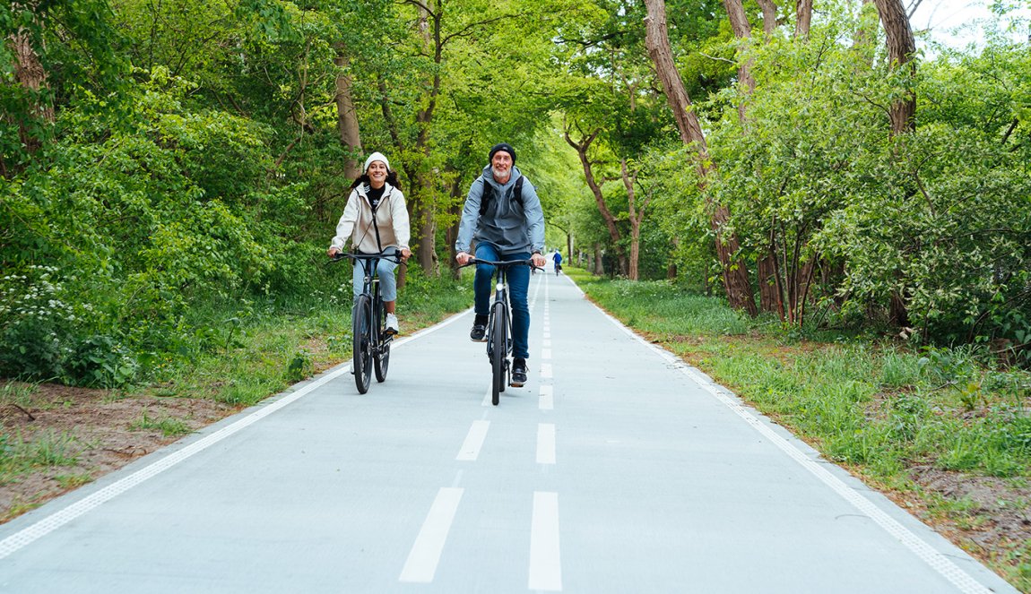 Cyclists on smooth wide bike path