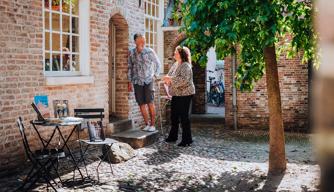 Judith Elders in courtyard with tree