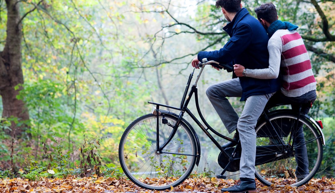 Two boys on bikes in the woods, fall