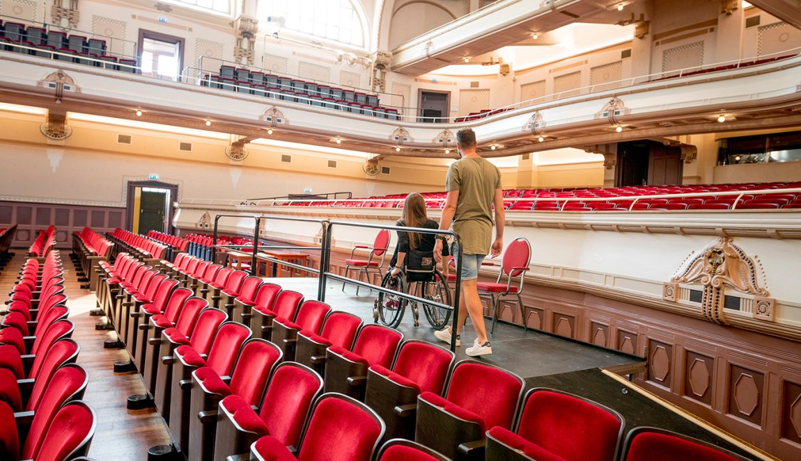 Couple visits Concertgebouw de Vereeniging Nijmegen. Lady is in a wheelchair.