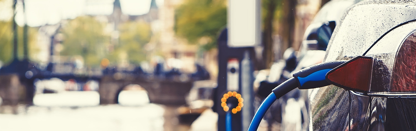 Electric car charging in the street of Amsterdam